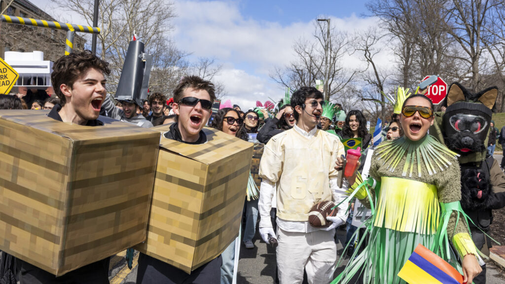 Students in costume cheer at Dragon Day 2026