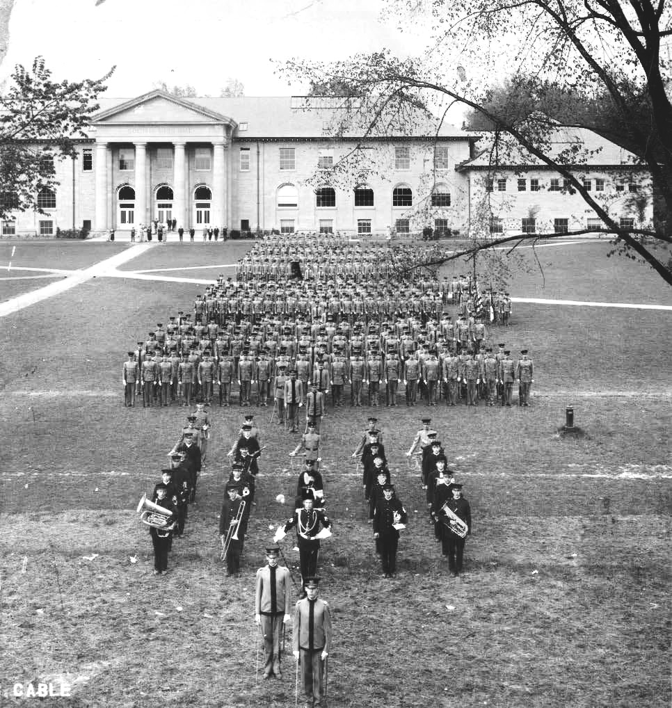 The Cornell cadet band in front of military drill students in formation on the Arts Quad