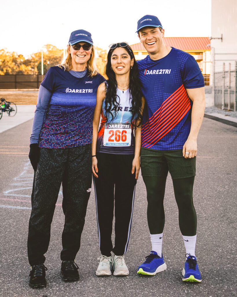 Adam Wolford (right) at a triathlon training camp with Christine Shaw Palmquist (left) and Manahil Jafri (center).