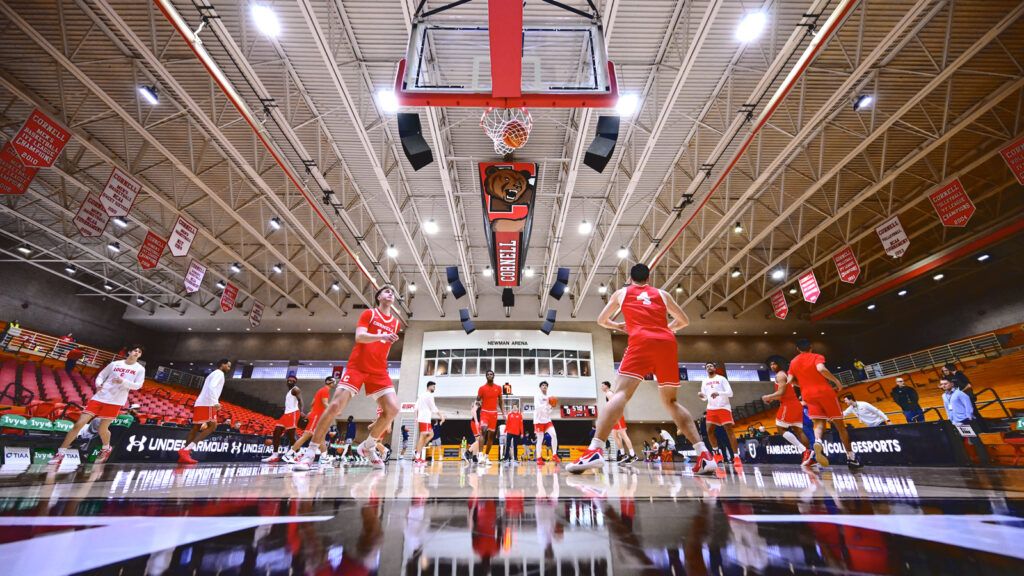 Cornell players warming up on the court