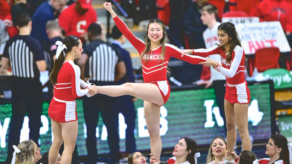 The Cornell cheerleaders in action