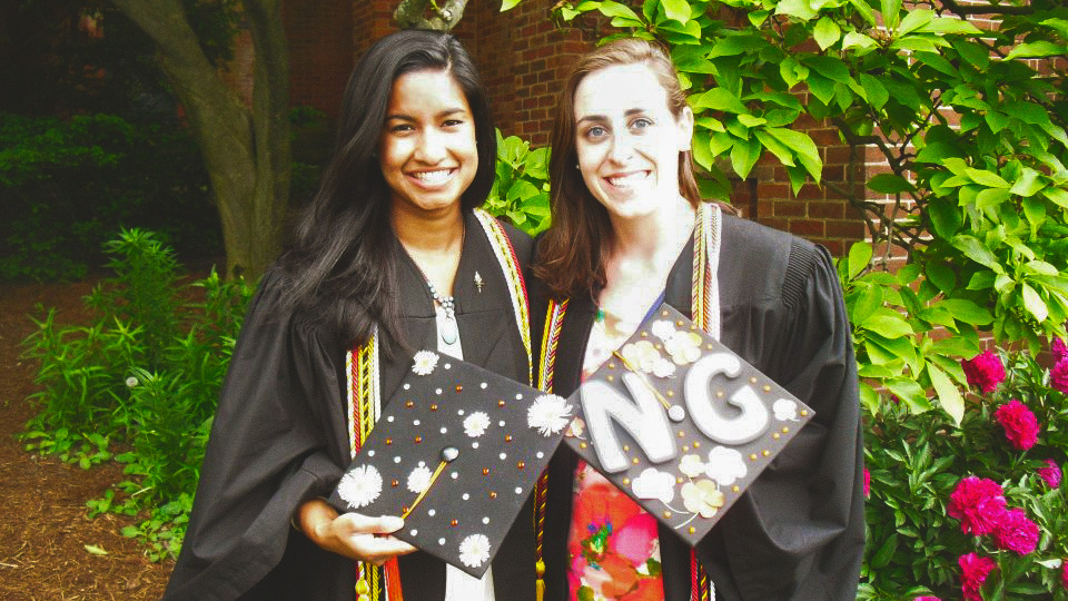 Mouleena Khan, left, with a friend at Commencement on the Hill