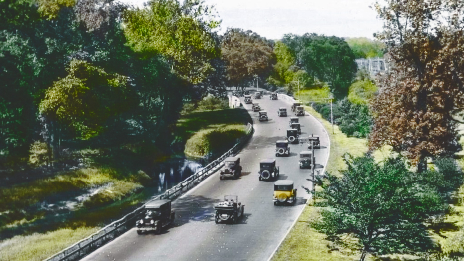 a hand-colored photograph of a section of the Bronx River Parkway in Westchester County, 1920s