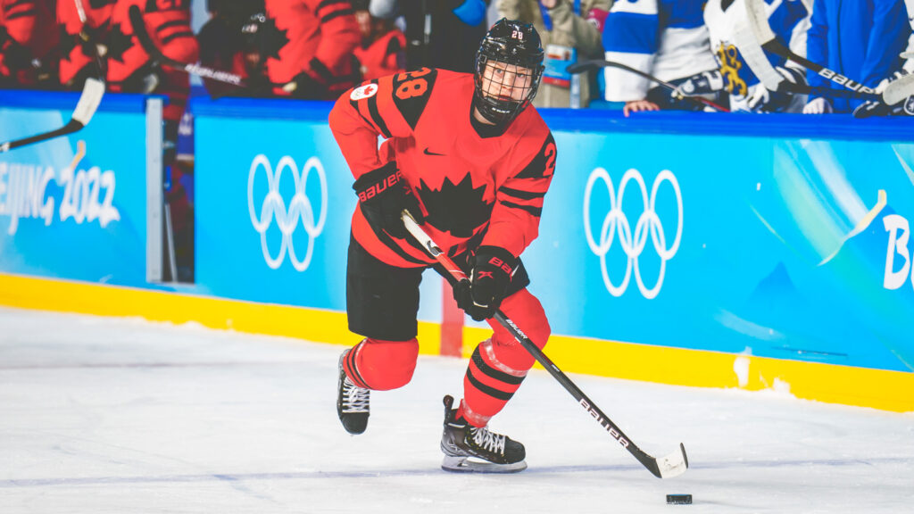 Micah Zandee-Hart skates with the puck for Canada during a game against Finland in the 2022 Olympic Winter Games in Beijing, China.