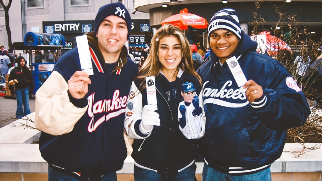 Justin McManus, at left, with two fellow castmates at Yankee Stadium during the 2007 season of the reality show “Ultimate Road Trip”