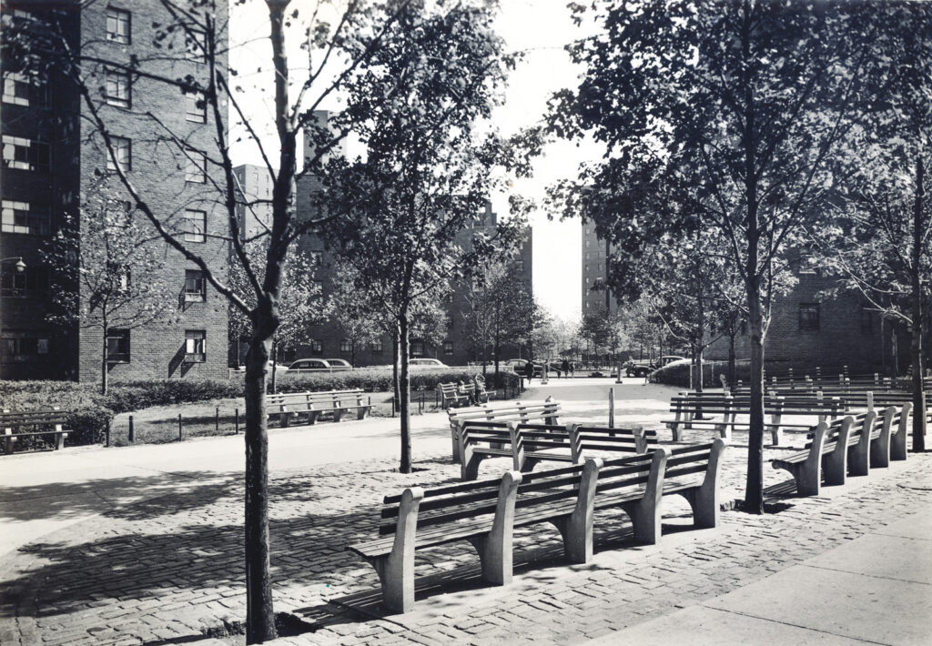 New York City's ubiquitous park bench—seen here in East Harlem in 1948—were designed by Gilmore Clarke and Michael Rapuano, based on a design they created for for Rye Playland in Westchester County