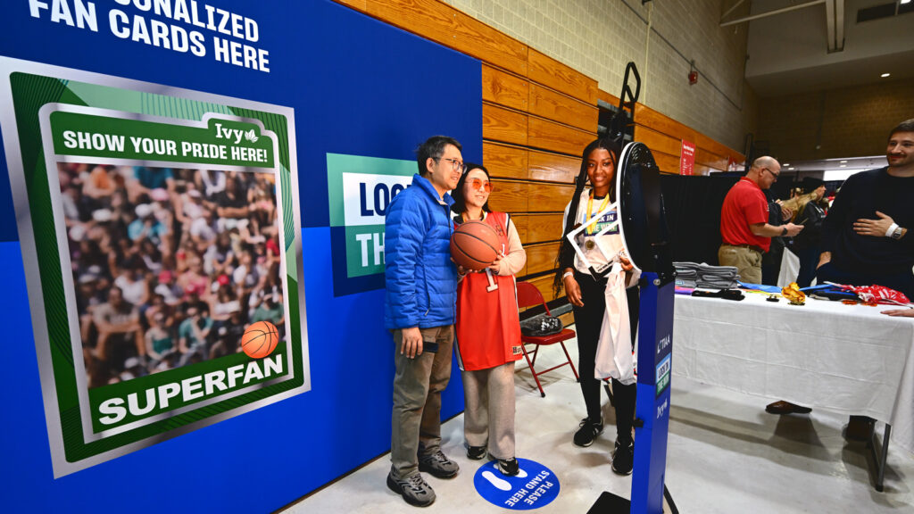Fans get their photo taken at a book that makes 'superfan' trading cards