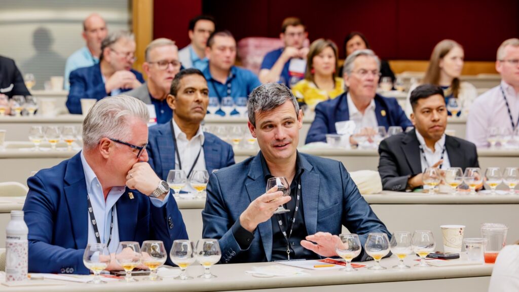 Hotel Ezra Cornell attendees taste whiskey during an event led by Noah Rothbaum, spirits editor at Men's Journal, during Hotel Ezra Cornell 2026