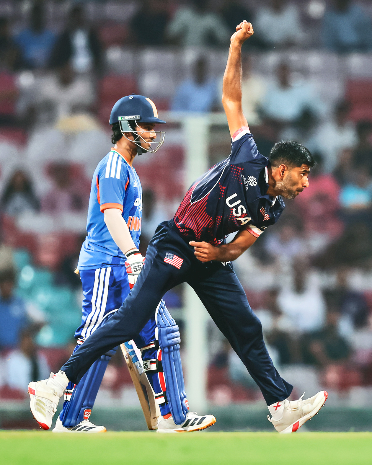 Saurabh Netravalkar bowls during a match against India.