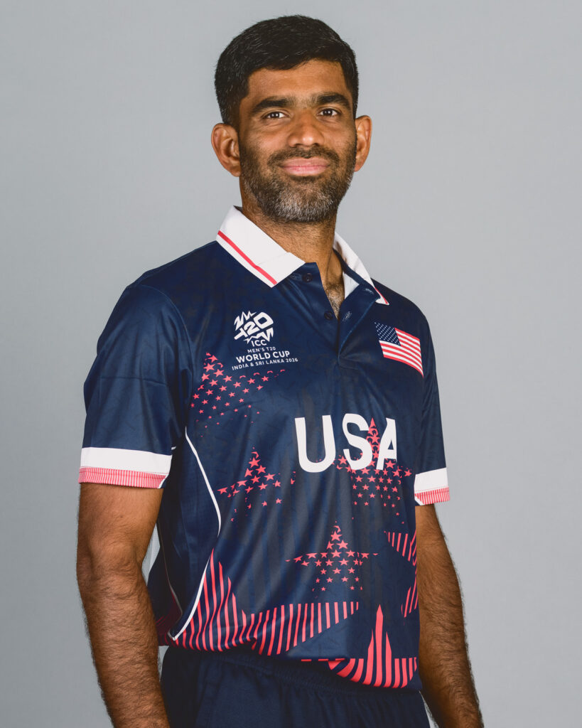 Saurabh Netravalkar smiles for a portrait in his Team USA jersey.