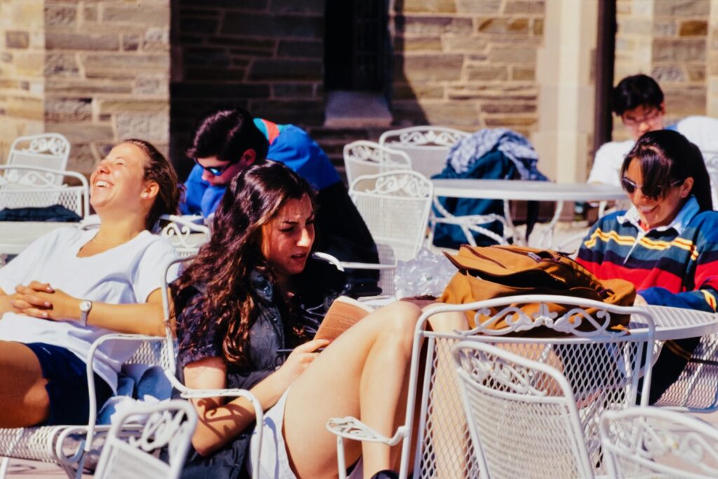 students enjoy spring air on the Willard Straight Hall terrace in spring 1997