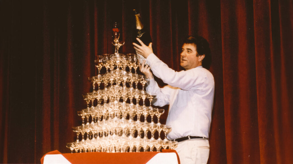 Giuseppe Pezzotti ’84, MMH ‘96, pours a pyramid of wine classes at Hotel Ezra Cornell in 1994