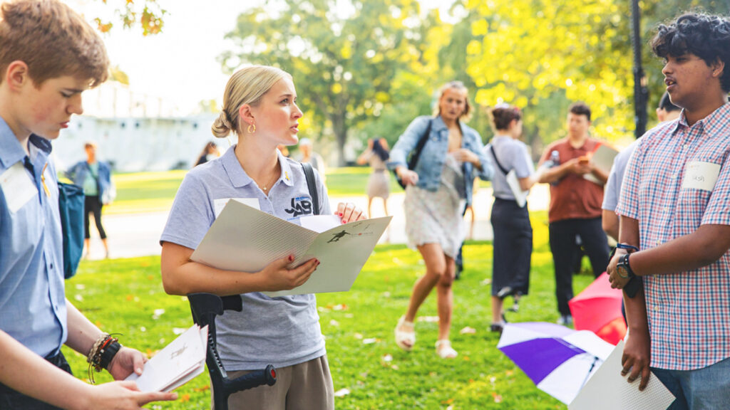 Camille Brady handing out literature in a park