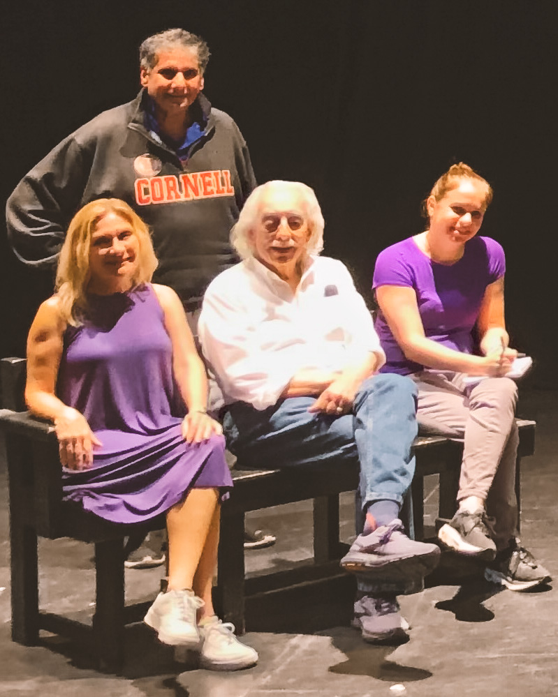 Rachel Krug (seated at right) with a professor and members of an acting class