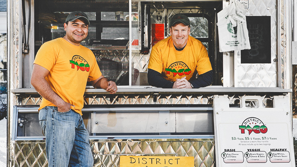Marc Wallace, right, along with his neighbor and District Taco co-founder, Osiris Hoil, in the original food truck they launched in 2009