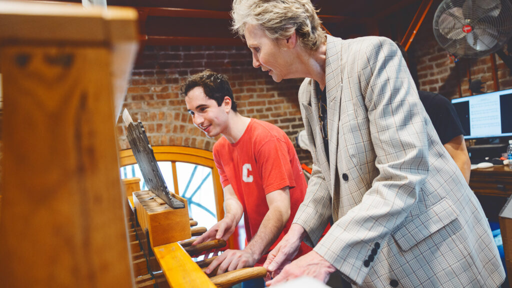 Jane Lynch plays the Chimes with a Chimesmaster.