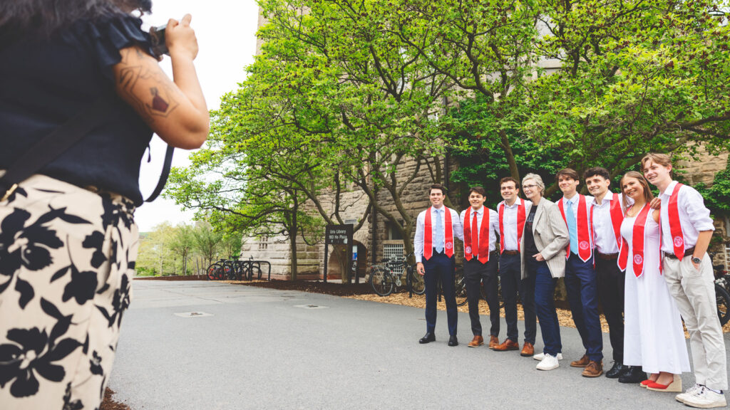 Jane Lynch poses with seniors outside Uris Library
