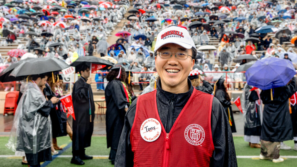 Volunteer Tony Chen on the field at Commencement
