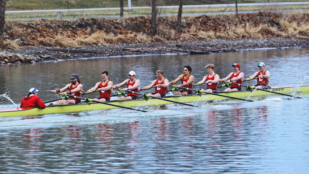The Cornell men's heavyweight rowing team rowing down Cayuga Inlet during a competition against Drexel.