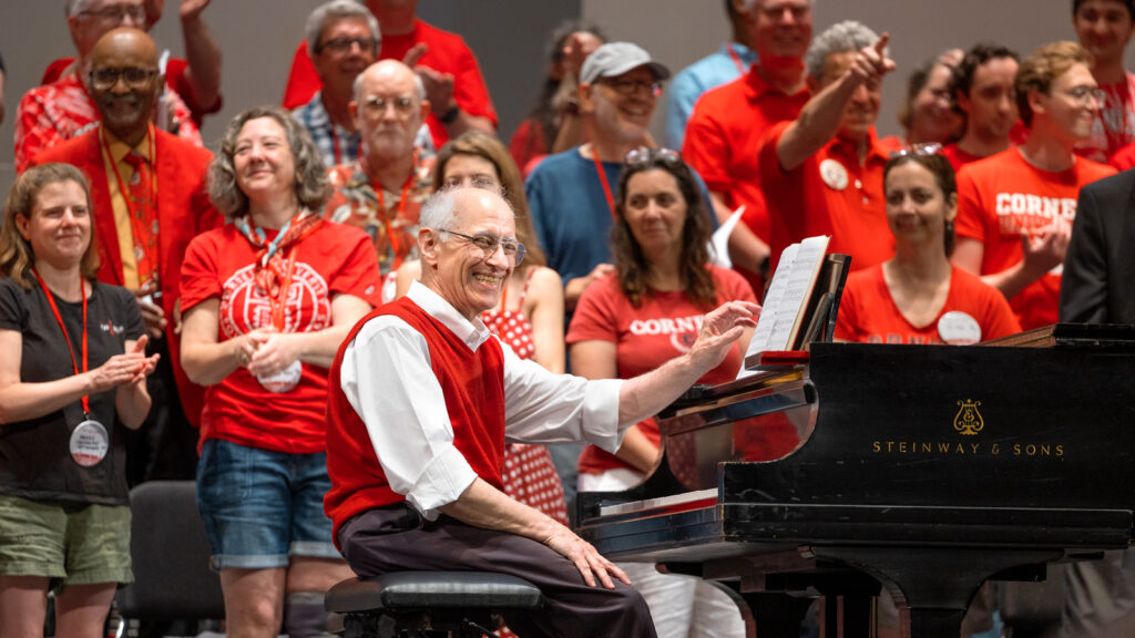 Bill Cowdery ’73, PhD ’89, smiles at the piano during Cornelliana Night at Reunion 2026