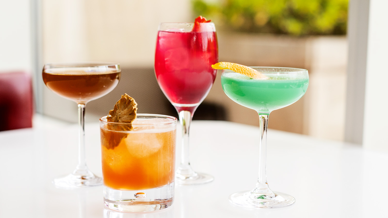Cocktails, from left to right, Sunday Best, Nicaraguan Goodbye, Hibiscus Spritz, and La Aventurina, in the Regent Lounge on Wednesday, June 10, 2026. (Ryan Young/Cornell University)