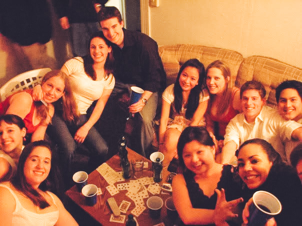 Colin Hodge sitting with a group of friends during college