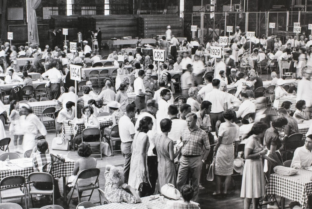 The CRC table is visible at the Barton Reunion lunch in 1964, amid the signs of other class years