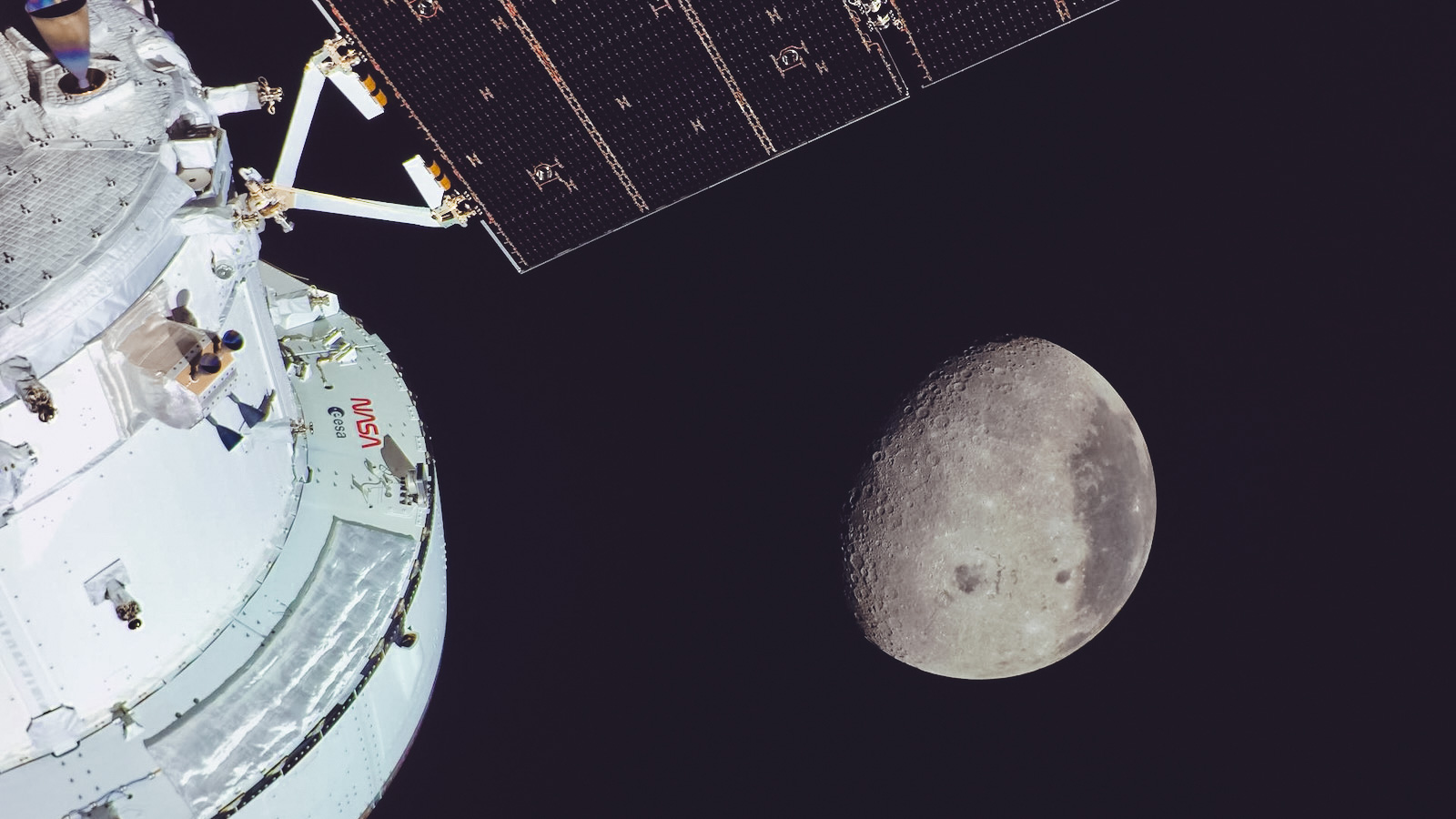 The moon with part of the Artemis II craft in the foreground