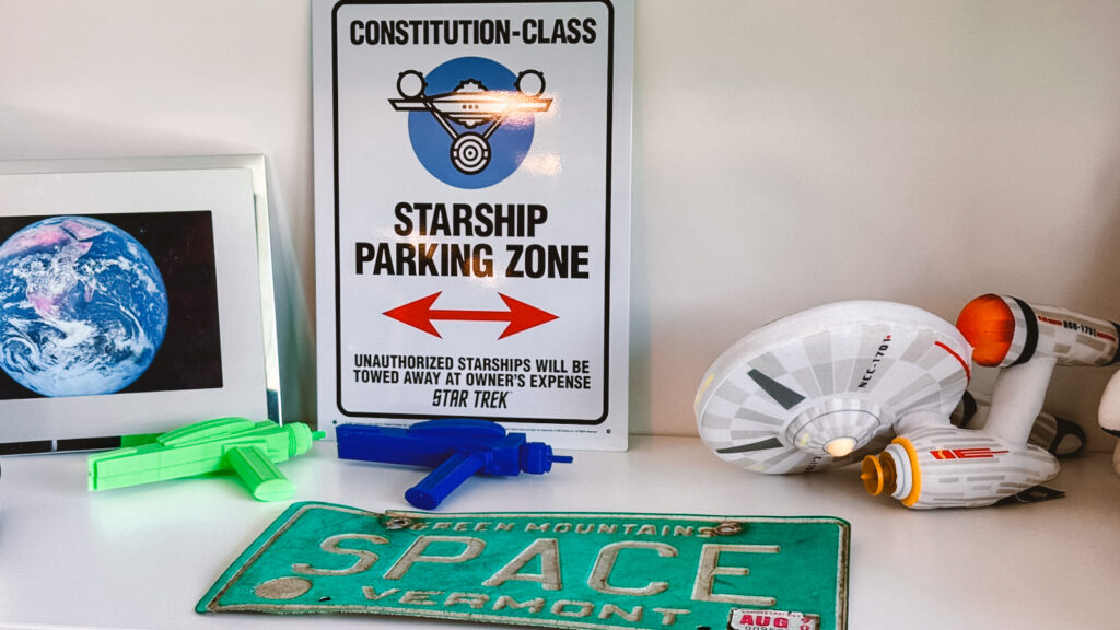 on a shelf in Margaret Weitekamp's office, a photo of Earth from space shares shelf space with "Star Trek" toys and other memorabilia