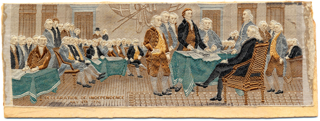 an embroidered ribbon, approximately eight inches wide, depicting the signing of the Declaration of Independence, circa 1876 and created for the occasion of the centennial