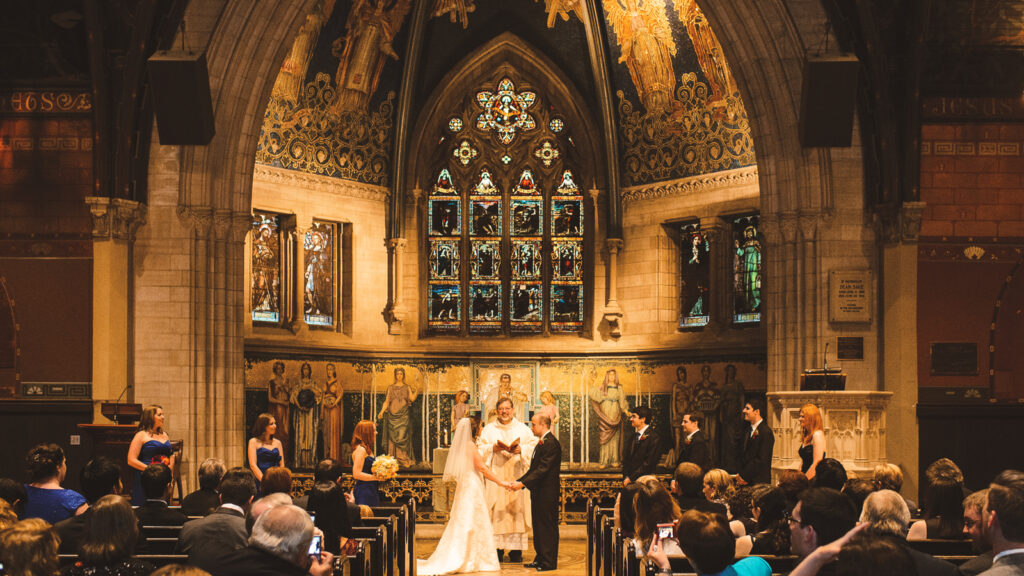 Kara Tappen Barry ’07 & Jordan Barry ’06, BS ’07 at the alter on their wedding day