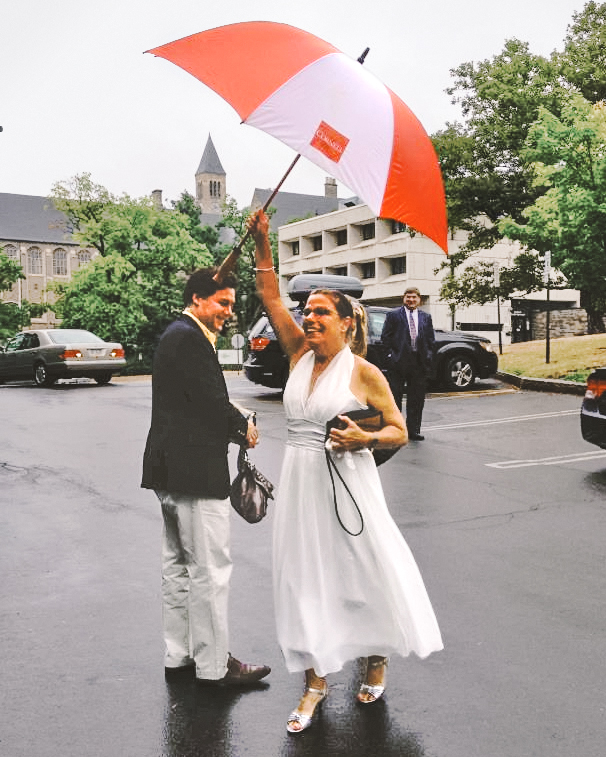 Karen Jewett-Bennett ’79 holding a Cornell umbrella on her way to her nuptials