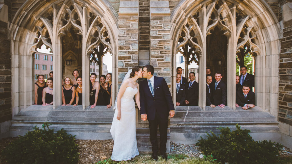 Erin McGonegle Crespi ’06 & Brian Crespi ’06 at the war memorial with their bridal party