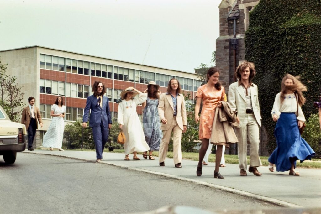 nine students in fancy dress walk near the Engineering Quad in 1974