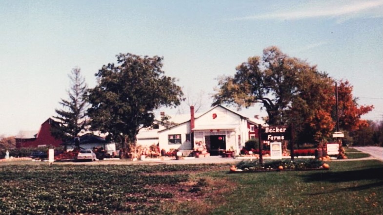A vintage photo of Becker Farms from the road.