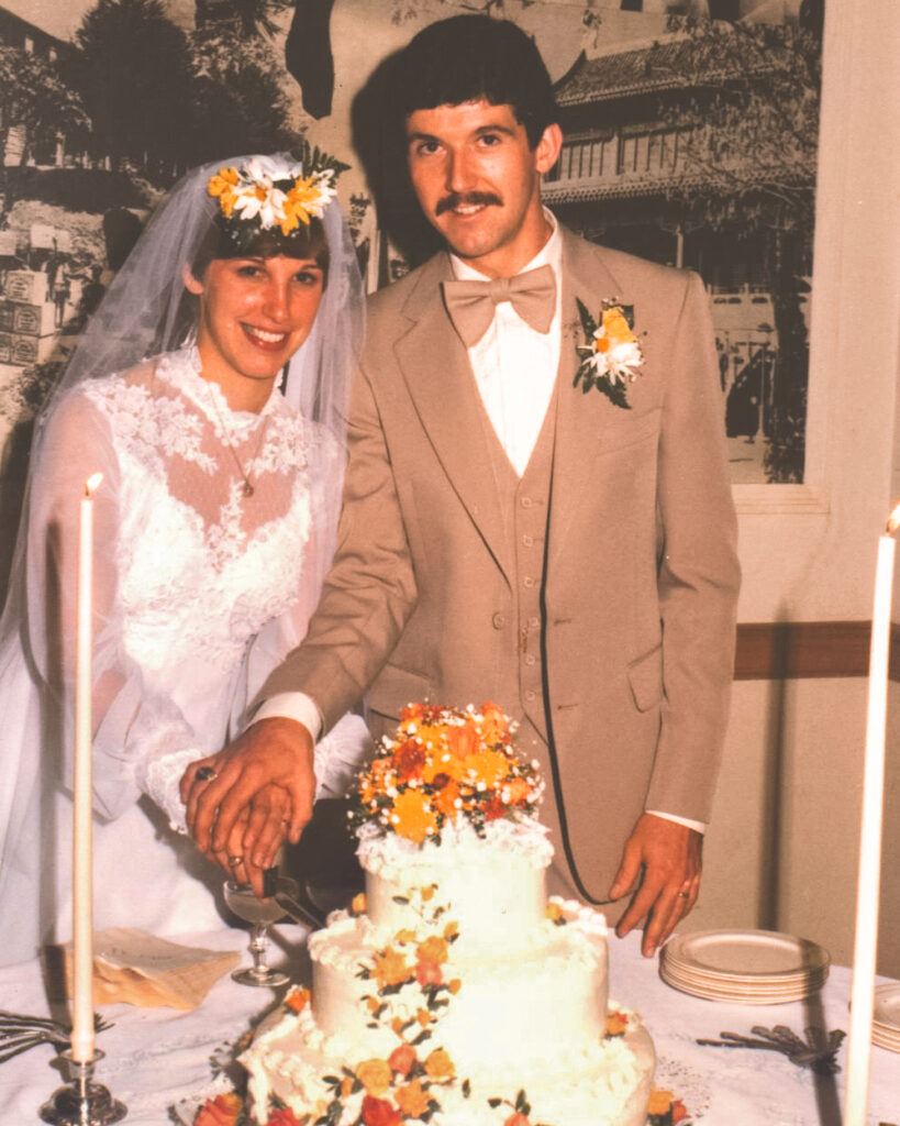Cathy Kullman Paddock ’78 & Ken Paddock ‘77 cut their wedding cake