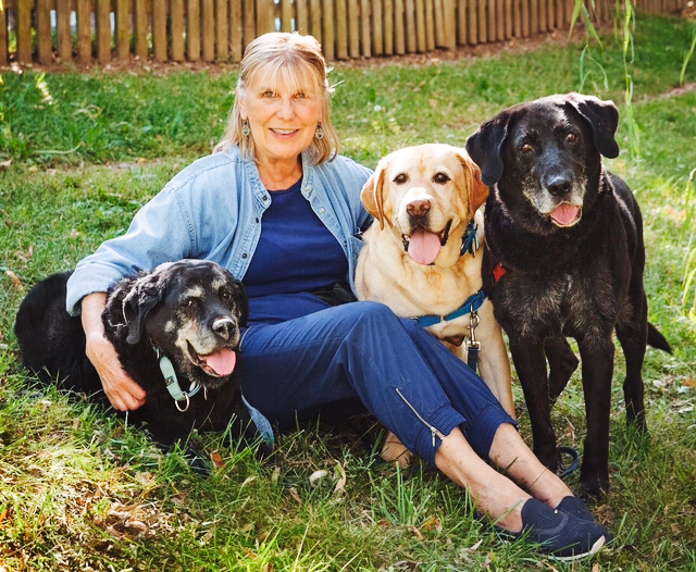 Barbara Osgood with three of her Lab dogs