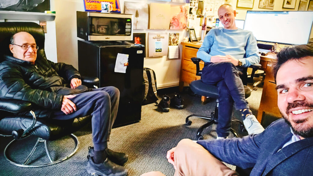 Richard Rand, Gordon Pennycook, and David Rand, seated in Pennycook's office