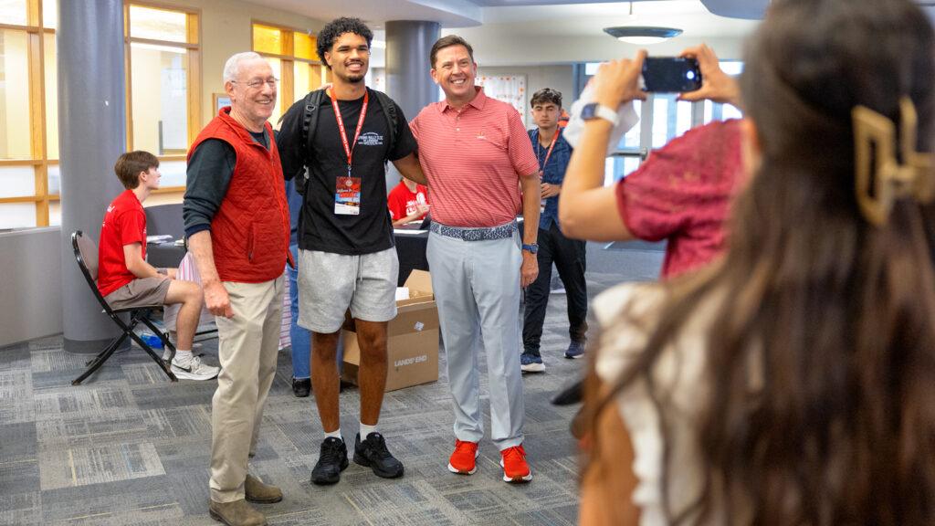 President Mike Kotlikoff and SCL VP Ryan Lombardi post with a new student in a dorm