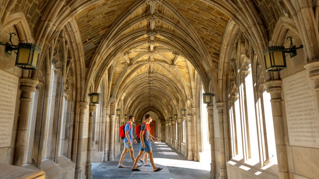 students cross through the War Memorial arches to West Campus during Move-In, August 2026