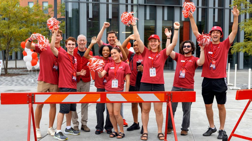 Student Move-In volunteers and President Kotlikoff cheer on North Campus during Move-In events, August 2026