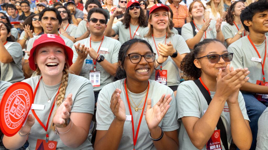 Students applaud during New Student Convocation Aug. 18, 2026 at Schoellkopf Field