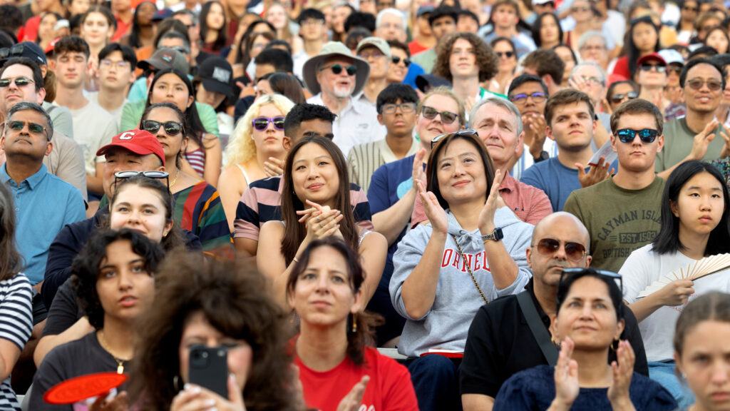 Students and parents applaud during New Student Convocation Aug. 18, 2026 at Schoellkopf Field