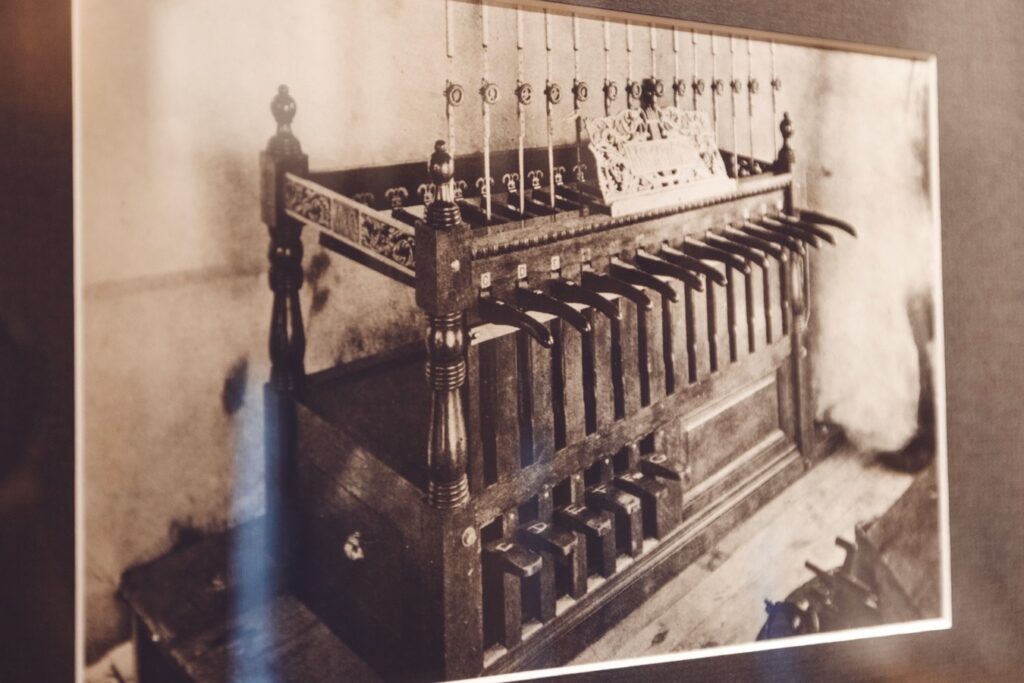 a framed, undated black-and-white photo in the Chimes Museum shows the first playing stand used by chimesmasters to strike the bells of the Cornell Chimes