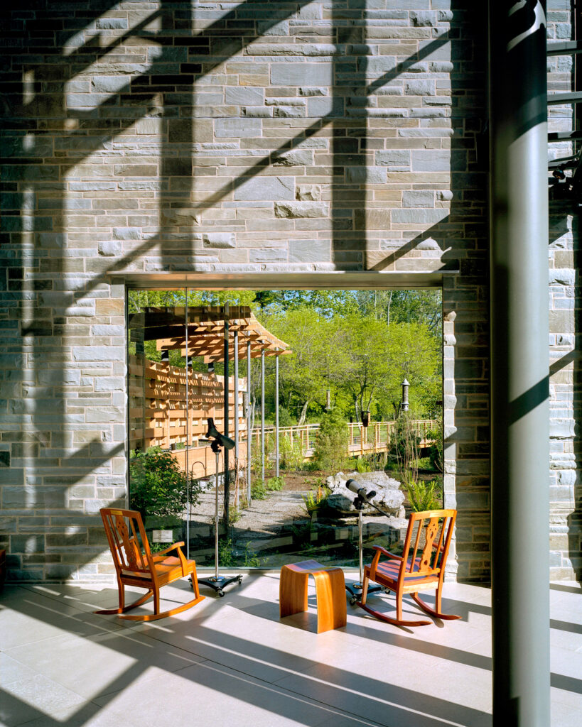 Photo by Brad Feinknopf ’86 of an outdoor patio and passageway at Cornell's Lab of Ornithology and Sapsucker Woods