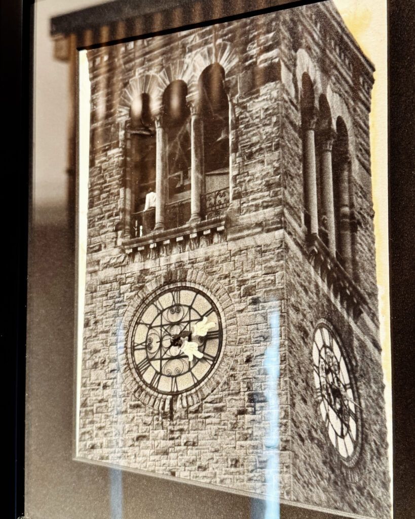 framed photograph in the Chimes Museum showing the clock tower when a pair of Disney-type cartoon hands were affixed to the clock hands in 1969