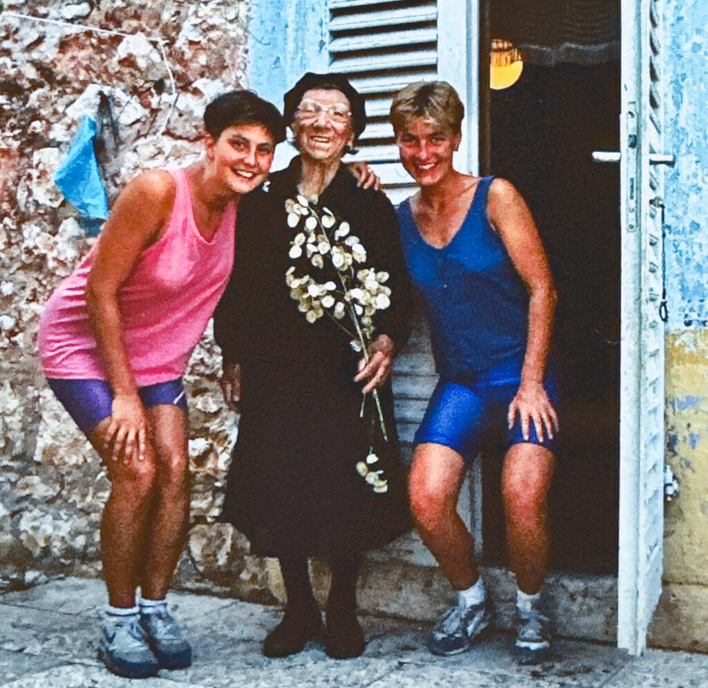 Penny Smith Eifrig and a friend with an elderly woman in 1990, outside the house she currently owns in Croatia