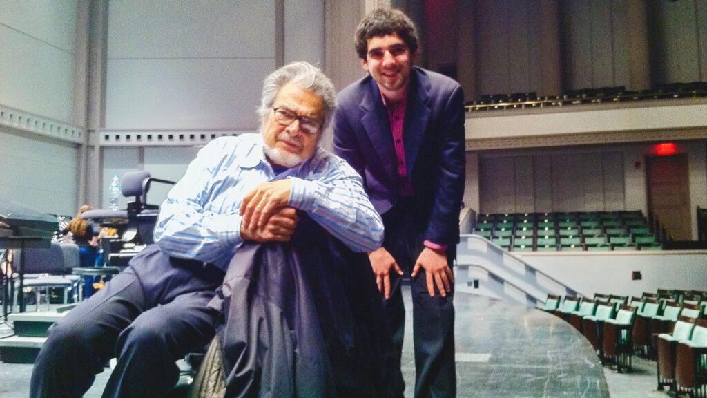 Daniel Anastasio as a student, smiling on stage with Leon Fleisher.