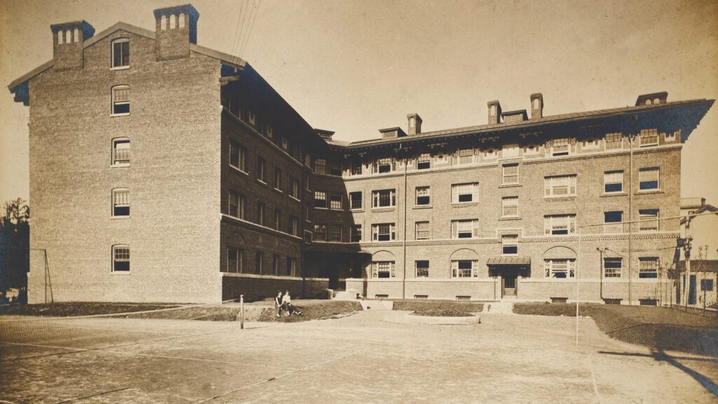 rear view of Sheldon Court shortly after its completion in the early 1900s, showing a tennis court on the property