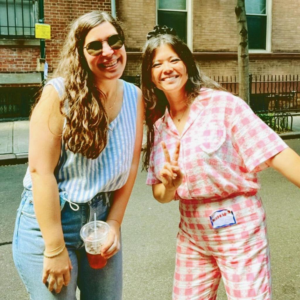 Alison Leiby smiling in a tank top and jeans with friend Natasha Pickowicz